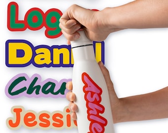 May include: White insulated water bottle with the name "Ashley" in red and pink script. The bottle is held by a person. Colorful name stickers are in the background, including "Riley", "Logan", "Dan", "Charlie", "Jessie", and "Bella".
