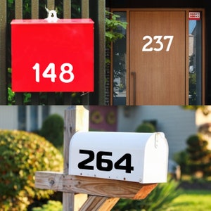 May include: Three different house numbers, 148, 237, and 264, are displayed on mailboxes and a door. The numbers are white on red, white on brown, and black on white.
