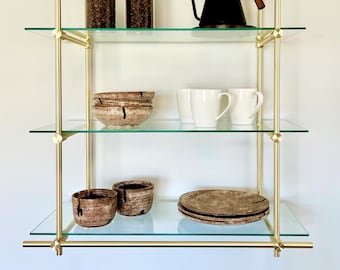 Wall Mounted Brushed Brass Shelves: 30 inches wide by 36 inches high by 12 inches deep.