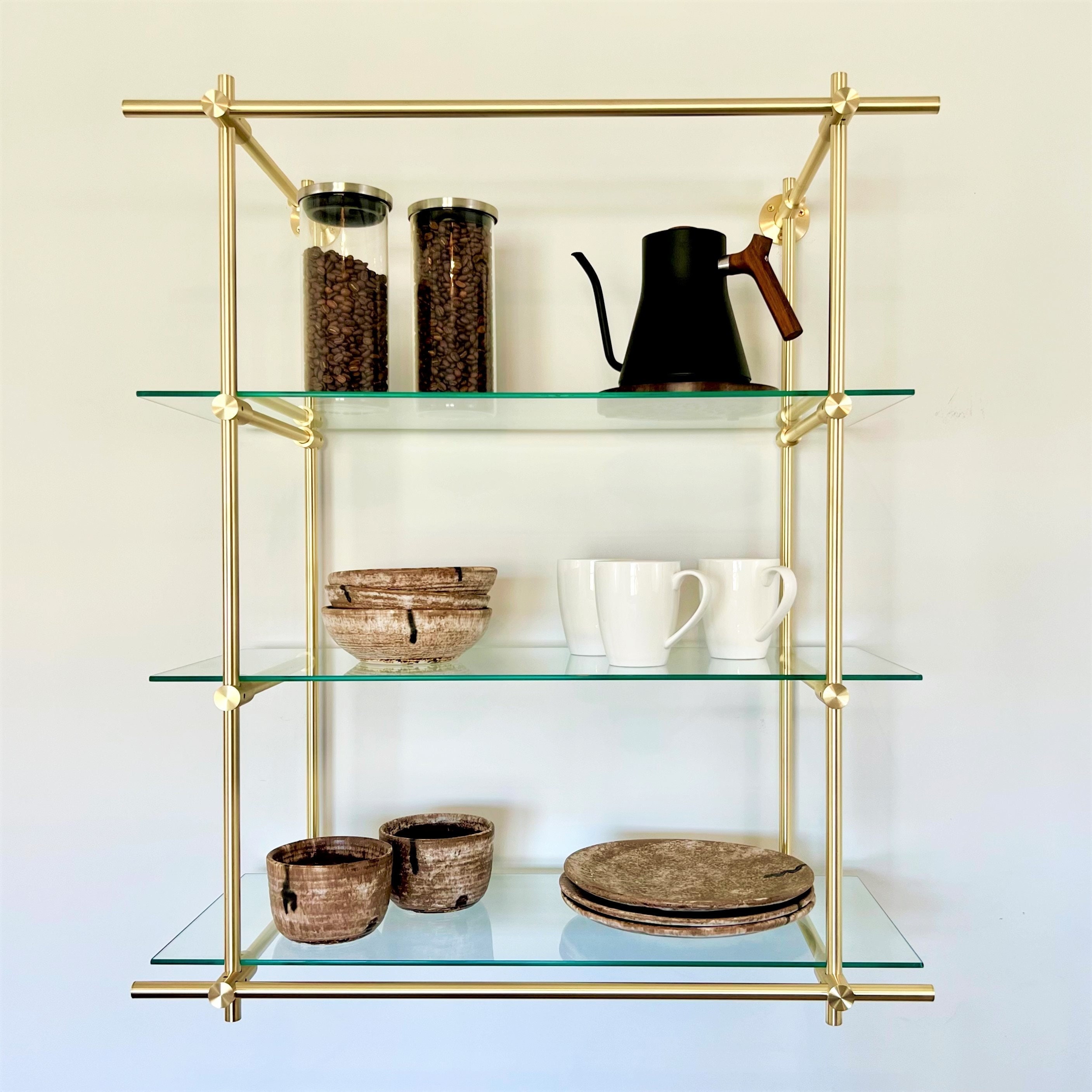 Wall Mounted Brushed Brass Shelves: 30 Inches Wide by 36 Inches High by 12  Inches Deep. 