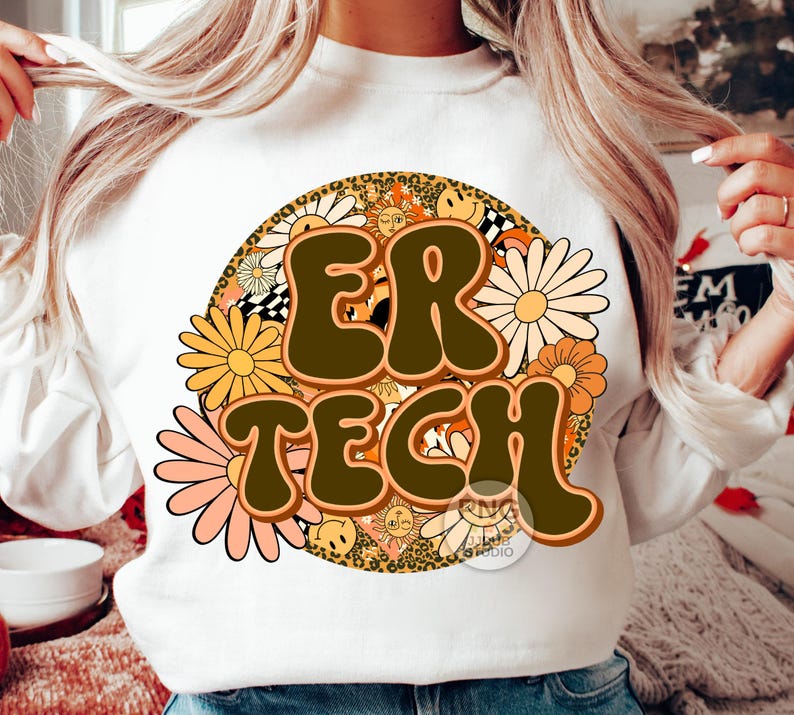 May include: White sweatshirt with a brown and yellow graphic design featuring the text "ER TECH" surrounded by flowers and other retro-style elements.