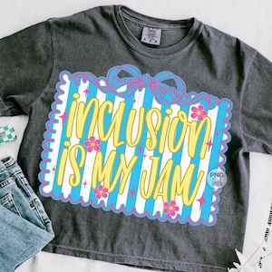 May include: Dark gray t-shirt with the phrase "INCLUSION IS MY JAM" in yellow script. The text is set against a blue and white striped background, framed by a pink scalloped border and adorned with pink flowers and stars.