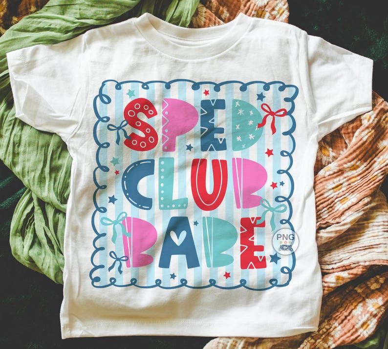 May include: White t-shirt with a colorful graphic that reads "SPEED CLUB BABE." The design features a blue and white striped background with the words in various colors, including red, pink, and blue. The design is framed with a blue scalloped border.