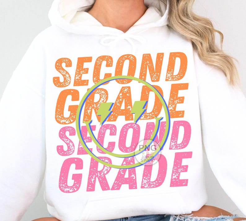 May include: White hoodie with a distressed graphic design that says "Second Grade" in orange, pink, and blue. The graphic includes a lightning bolt and a smiley face.