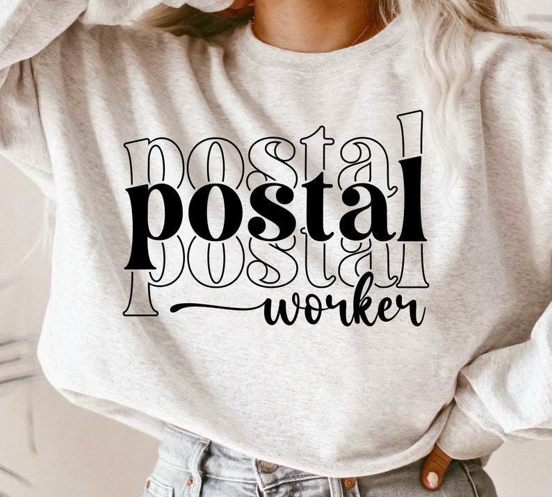 May include: A gray sweatshirt with black text that reads "postal worker" in a layered, stylized font.