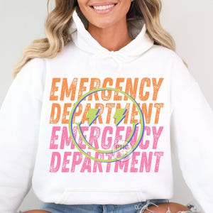 May include: White hoodie with the text "EMERGENCY DEPARTMENT" repeated twice in orange and pink with a green circle and lightning bolt graphic.