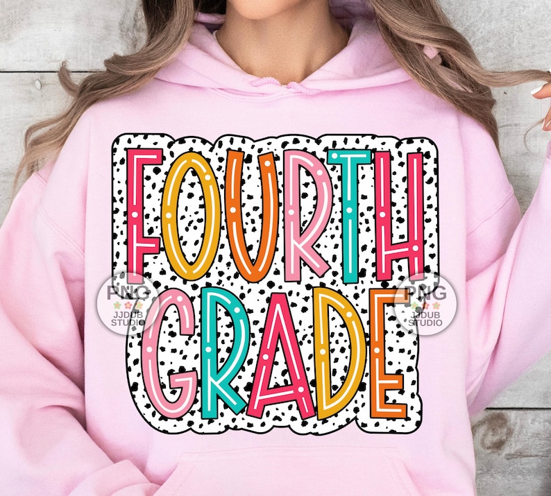 May include: Pink hoodie with a colorful graphic that says "FOURTH GRADE" in a black and white polka dot pattern.