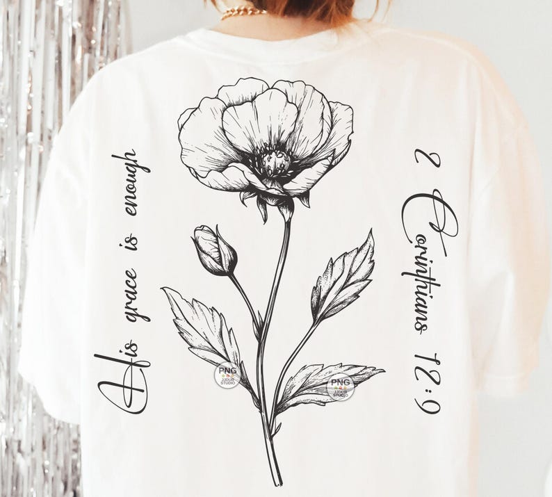 Peut inclure: T-shirt blanc avec une illustration en noir et blanc d'une fleur et le texte "Sa gr&acirc;ce suffit 2 Corinthiens 12:9"