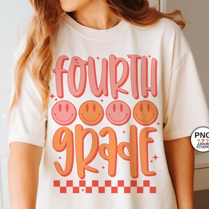 May include: A white t-shirt with the text "FOURTH GRADE" in pink and orange with a row of four smiley faces in pink and orange above the text. The text has a retro, 70s style font. There is a checkered pattern at the bottom of the shirt.