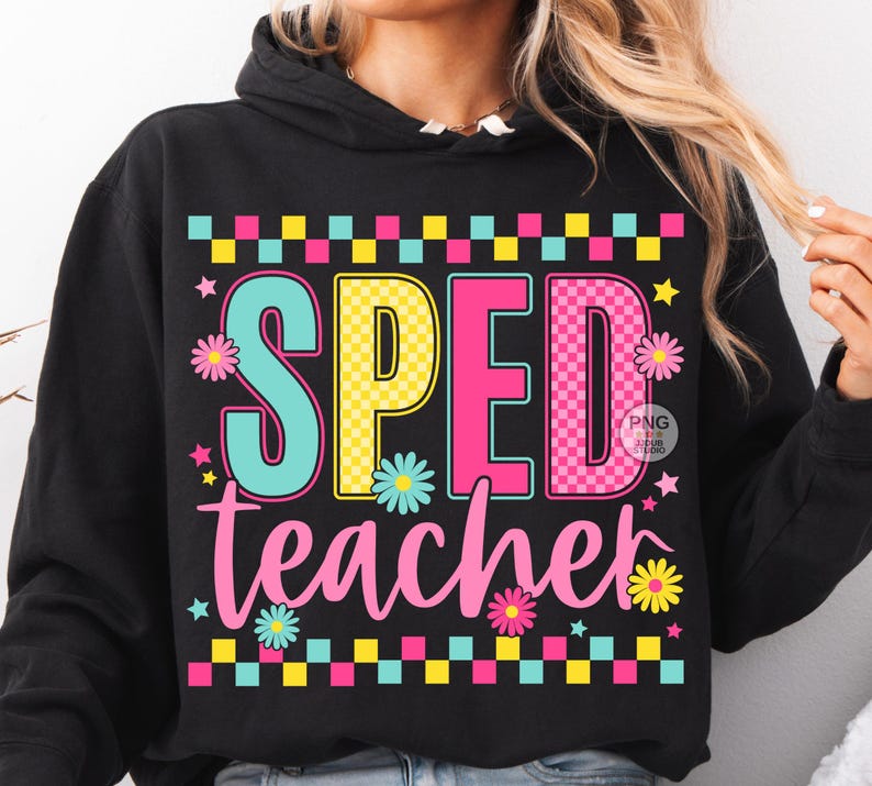 May include: Black hooded sweatshirt with the words "SPED teacher" in colorful block letters and a floral design. The letters are teal, yellow, and pink, with a checkered pattern above and below the text.