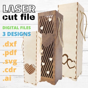 May include: Three laser cut wooden boxes with heart designs. The boxes are for wine bottles and have a rope handle. The text on the image reads "LASER cut file DIGITAL FILES 3 DESIGNS .dxf .pdf .svg .cdr .ai"