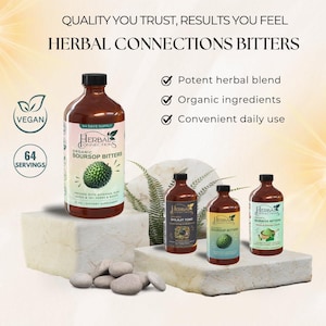 May include: Three glass bottles of organic herbal bitters, labelled "Soursop Bitters", "Shilajit Tonic", and "Moringa Bitters". The bottles are on a light brown surface with a fern and rocks in the background. The bottles are all brown glass with white labels and green accents. The text "64 Days Supply" and "64 Servings" is visible on the bottle labelled "Soursop Bitters".