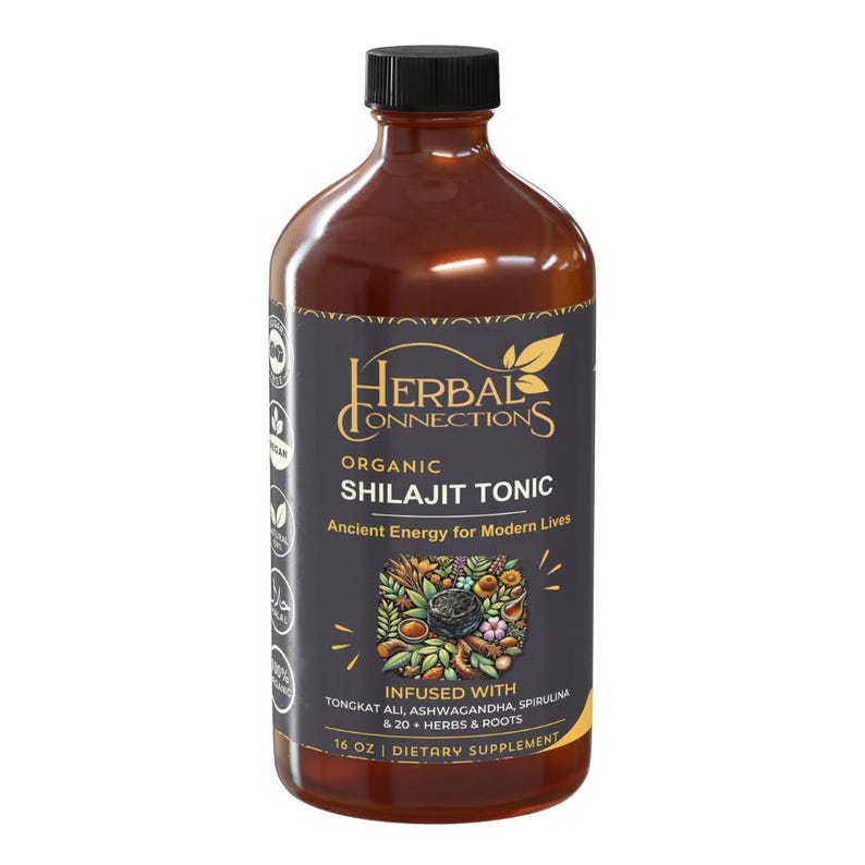 Puede incluir: Una botella marr&oacute;n con tapa negra, etiquetada como "Herbal Connections Organic Shilajit Tonic". La etiqueta incluye el texto: "Ancient Energy for Modern Lives" e "Infused with Tongkat Ali, Ashwagandha, Spirulina & 20+ Herbs & Roots". La botella contiene 473 ml de suplemento diet&eacute;tico.
