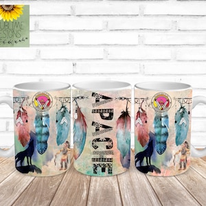 May include: Three white ceramic mugs with a colorful design featuring feathers, a wolf, and the word "APACHE" in black and white. The mugs have a black and white geometric pattern around the word "APACHE".
