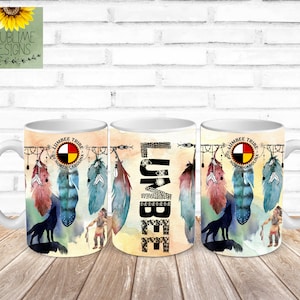 May include: Three white ceramic mugs with a design featuring a wolf, feathers, and the text "LUMBEE TRIBE OF NORTH CAROLINA".
