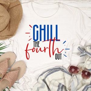 May include: White t-shirt with red and blue text that says "Chill the Fourth Out". The shirt is laid out on a white wooden surface with a straw hat, sandals, sunglasses, and a pair of striped pants.