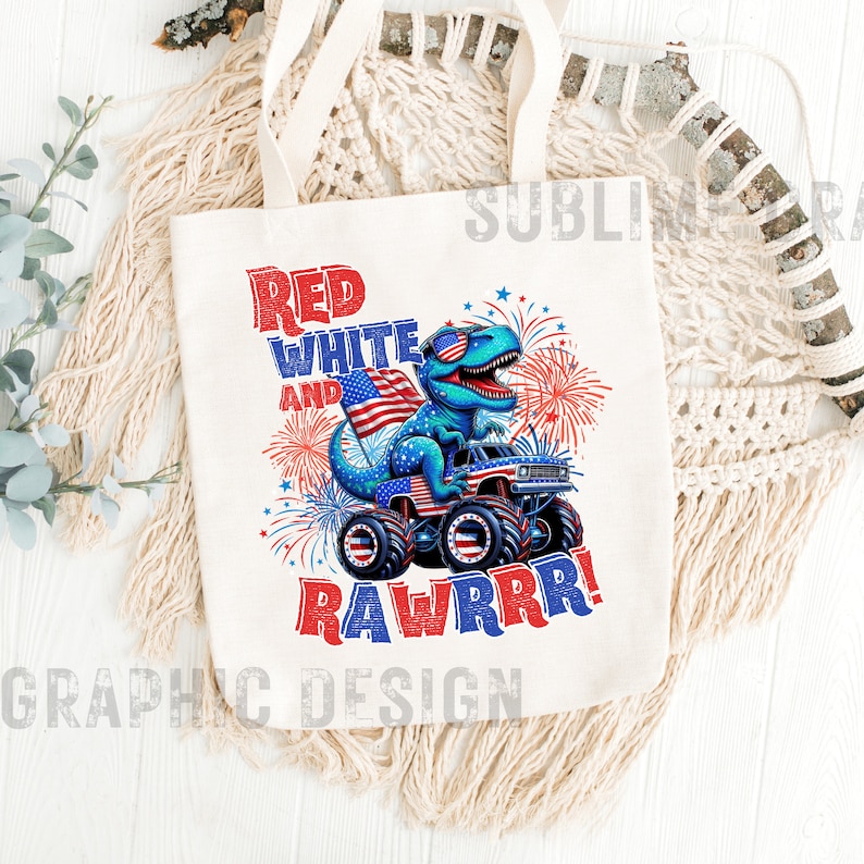 May include: A white tote bag with a red, white, and blue dinosaur wearing sunglasses and driving a monster truck. The text "Red White and Rawrrr!" is printed on the bag.
