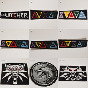 May include: A set of cross-stitch patches featuring the Witcher logo, the five Witcher signs, and the Wolf School medallion in various sizes. The patches are black with white, red, yellow, green, blue, and purple thread.