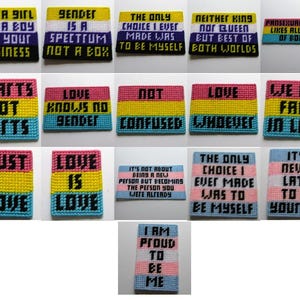Puede incluir: Una colección de parches de tapiz coloridos y hechos a mano con varios mensajes de texto. Los parches presentan frases como "Gender is a Spectrum", "Love is Love" y "I am Proud to be Me". Los parches son de varios colores, incluyendo amarillo, rosa, azul y negro.