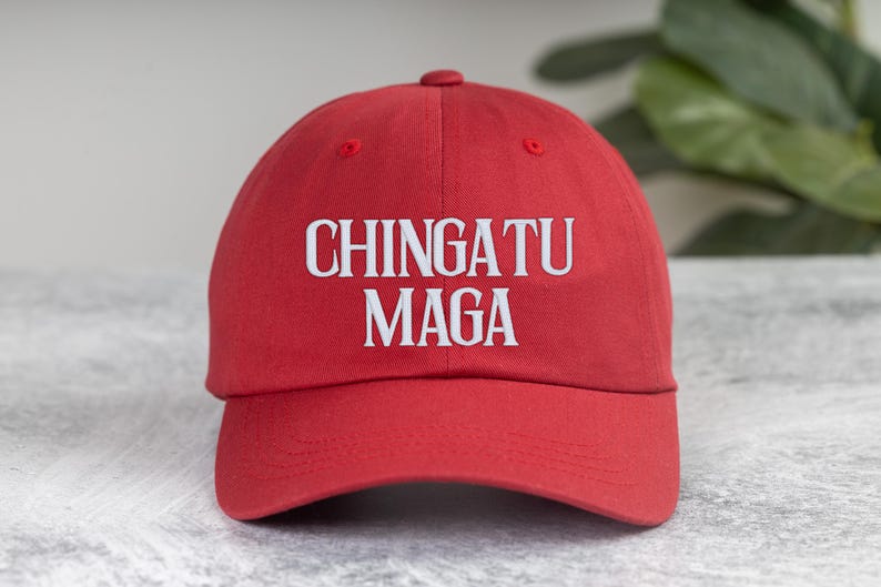 May include: Red baseball cap with white embroidered text that reads "CHINGATU MAGA".