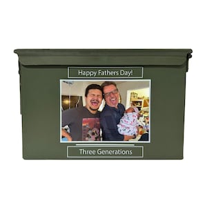 May include: A green metal ammo can with a photo of three generations of a family. The photo is captioned "Happy Fathers Day!" and "Three Generations".