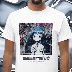 May include: White t-shirt with a graphic of a blue anime-style girl with long hair and a pink and white background. The text "sewerslut" is printed in black below the graphic, with the Japanese text "ラプストリーを排出" below that.