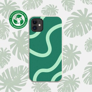 May include: A green phone case with a white abstract design. The case is made from 100% biodegradable material.