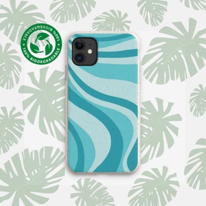 May include: A blue and white phone case with a wavy pattern. The case is made of biodegradable material and has a white border. The case is on a white background with green leaves.