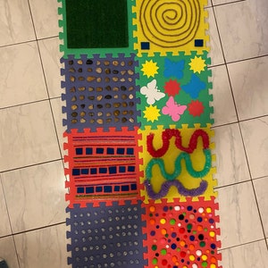 Alfombra sensorial bebe sale
