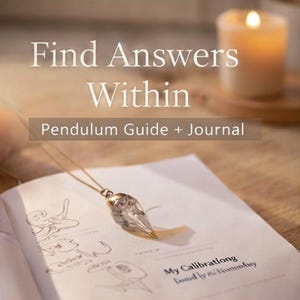 May include: An open book with the text "Find Answers Within" and "Pendulum Guide + Journal". A clear crystal pendulum hangs over the pages. A lit candle is in the background.