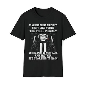 May include: Black t-shirt with a graphic of a monkey wearing a suit and holding two guns. The text on the shirt reads "If you're going to fight, fight like you're the third monkey on the ramp to Noah's ark and brother it's starting to rain."