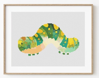 May include: A cross-stitch pattern of a green and yellow caterpillar with a white belly. The caterpillar is curled up in a C shape.