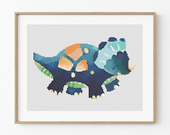 May include: A cross-stitch pattern of a blue, green, and orange triceratops dinosaur. The dinosaur is facing right and has a frill on its head.