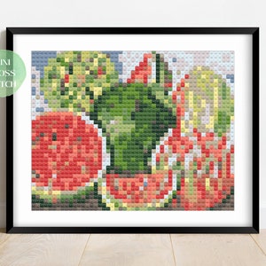 Peut inclure: Modèle de point de croix représentant une nature morte avec des tranches de pastèque et des feuilles vertes. Le motif est dans un cadre noir et est prêt à être brodé.