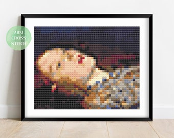 May include: A cross stitch pattern of a woman with red lips and a patterned dress, framed in black.