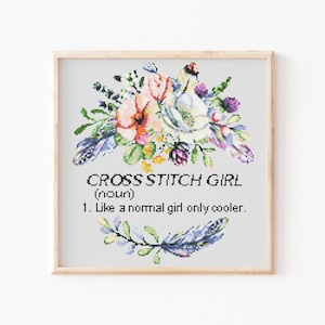 May include: Cross stitch pattern with a floral design and the text "CROSS STITCH GIRL (noun) 1. Like a normal girl only cooler."