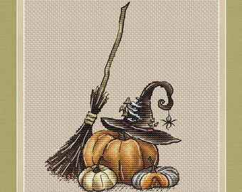 May include: A witch's hat with a spider on it sits on top of three pumpkins. A brown broom leans against the pumpkins.