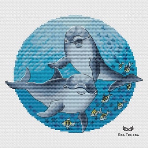 May include: Cross-stitch pattern of two dolphins swimming in a blue circle with yellow fish. The pattern is by Eva Teheva.