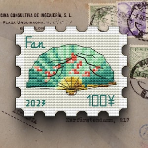 May include: A cross-stitch design of a fan with red floral accents, set within a postage stamp frame. The word "Fan" is written above the fan. The stamp also includes the numbers "2023" and "100¥".