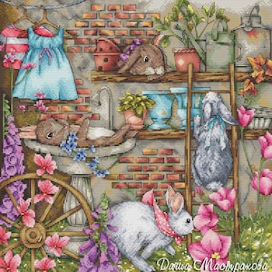 May include: A detailed cross-stitch design featuring a whimsical garden scene. Bunnies, flowers, and gardening tools are depicted against a brick wall backdrop. A blue dress hangs on a clothesline, adding a touch of domesticity.