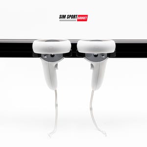 May include: Two white VR controllers with black straps are mounted on a black rail. The controllers are hanging down with their cords attached. The text "SIM SPORT GADGET" is printed in black and red above the rail.