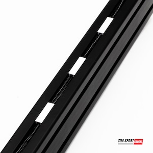 May include: Close-up of a black metal track with white plastic clips. The track is designed for mounting racing simulators and other gaming equipment. The text "SIM SPORT GADGET" is visible in the lower right corner of the image.