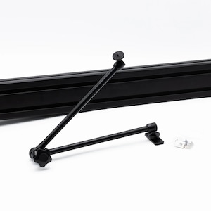 May include: Black adjustable camera arm with a ball head and a knob for tightening. The arm is mounted on a black aluminum track.