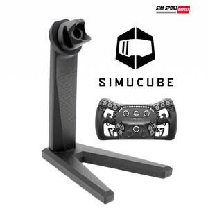 May include: Black racing wheel and stand. The stand is black and has a unique design to hold the wheel. The wheel has multiple buttons and a central logo. The text "SIMUCUBE" is displayed.