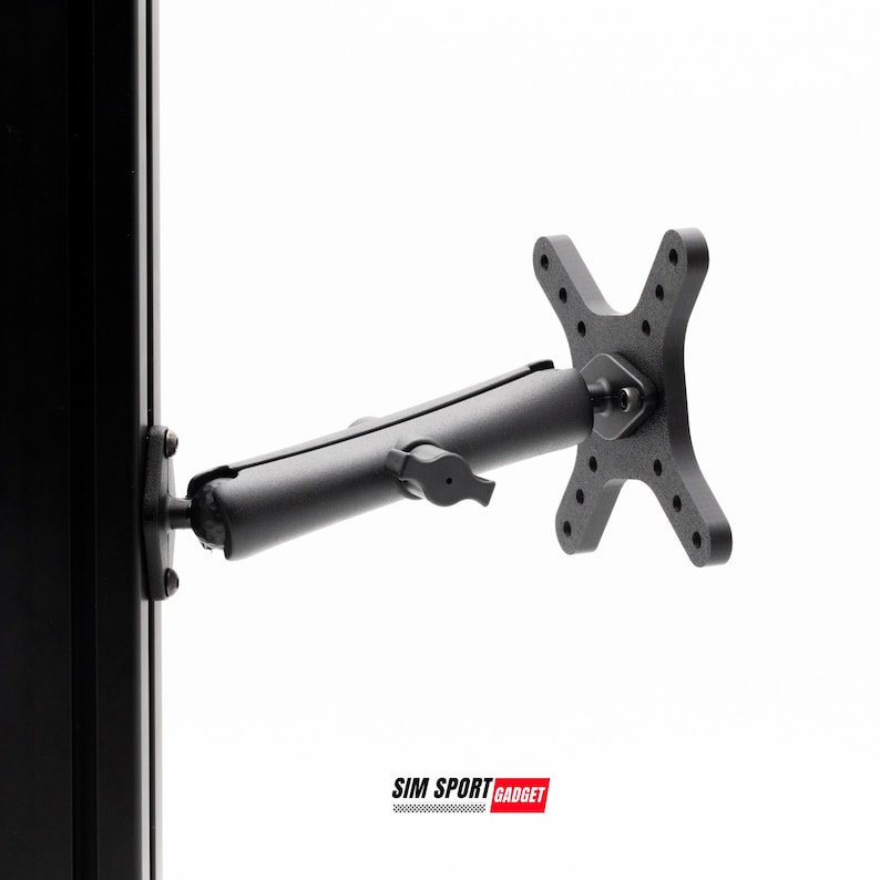 May include: A black monitor mount with an adjustable arm and a cross-shaped mounting plate. The mount is attached to a black vertical support. The text "SIM SPORT GADGET" is visible in the lower right corner.