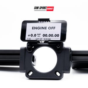 May include: A black racing simulator steering wheel mount with a digital display that reads "ENGINE OFF +0.0 00.00.00 11:42 sec. LAST LAP: 00.00.000 75".
