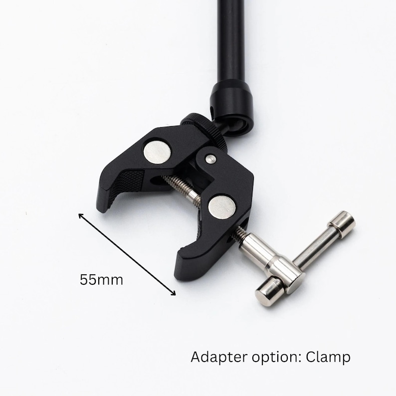 May include: Black clamp with a 55mm opening, a silver knob, and a black metal arm. Adapter option: Clamp.