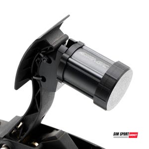 May include: A close-up shot of a black SIMAGIC racing simulator pedal assembly. The pedal features a cylindrical component with the SIMAGIC logo and a textured, silver end. The assembly is mounted on a black base.