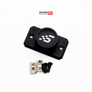 May include: Black rectangular device with a circular top featuring a white graphic and the text "SIM SPORT GADGET". Includes silver metal pieces and black screws. The device has two holes. The background is white.