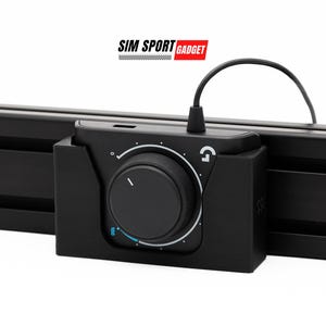 May include: A black Logitech G Hub audio mixer with a volume knob and a blue accent line. The mixer is mounted on a black track system.